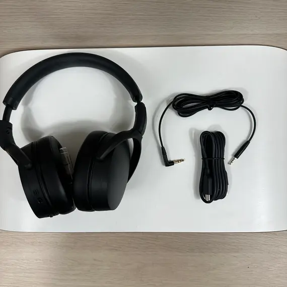 Sennheiser Epos Adapt 360 headphones with active noise-canceling technology displayed on a desk next to a laptop